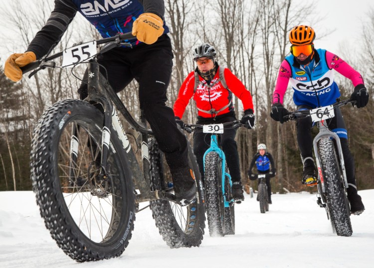 George Lowe, left, of Lyndonville, Vt.; David Anderson, center, of Waterboro; and Alan Pimentel of Gray are among the competitors in a fat bike race in Bethel.