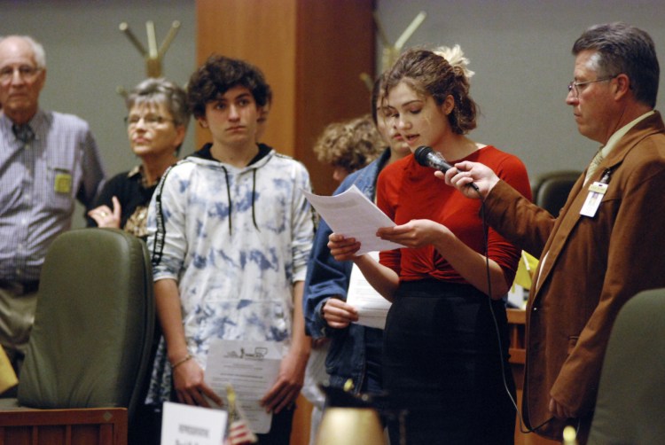 High school student Sophia Lussiez, 17, of Santa Fe, N.M., second from right, testifies in support of proposals for new gun safety regulations in New Mexico, in Santa Fe, N.M., earlier this month.