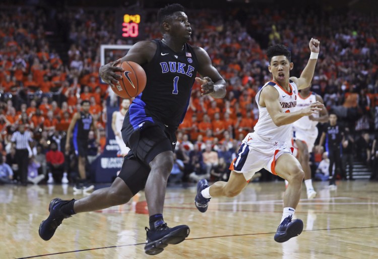Zion Williamson of Duke goes strong to the basket during the Blue Devils' 81-71 win over Virginia on Saturday in Charlottesville, Va.