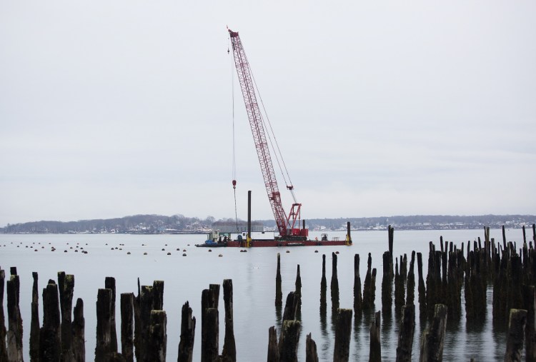 Fore Points Marina is expected to open this spring and is the first phase of the former Portland Co. complex project on the city's eastern waterfront. Above, workers have been on the water since November setting anchor blocks for the floating docks.