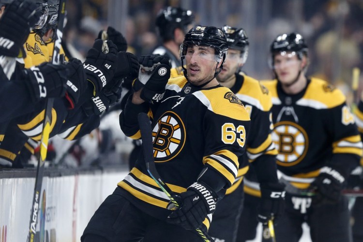Brad Marchand celebrates his first-period goal Tuesday night against the Chicago Blackhawks at Boston.