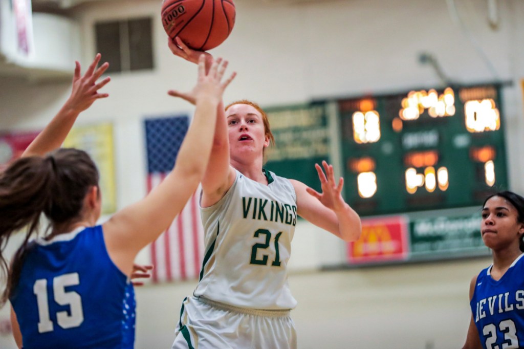 Julia Colby of Oxford Hills drives for a basket during a Class AA North quarterfinal Tuesday night against Lewiston. Top-seeded Oxford Hills cruised to a 77-26 win.