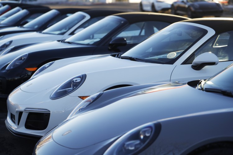 A long row of unsold 2019 911 Carrera GTS cabriolets sits at a Porsche dealership in Littleton, Colo. Borrowers are behind in their auto loan payments in numbers not seen since delinquencies peaked at the end of 2010, according to the Federal Reserve Bank of New York.