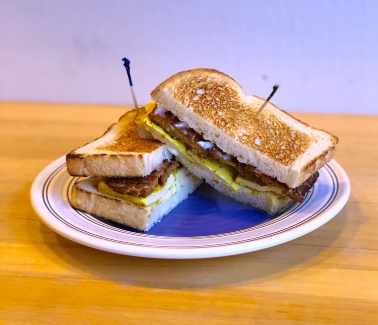 The brand-new vegan breakfast sandwich at Baristas + Bites comes with plant-based eggs, bacon and cheese, all made from scratch in the bakery.