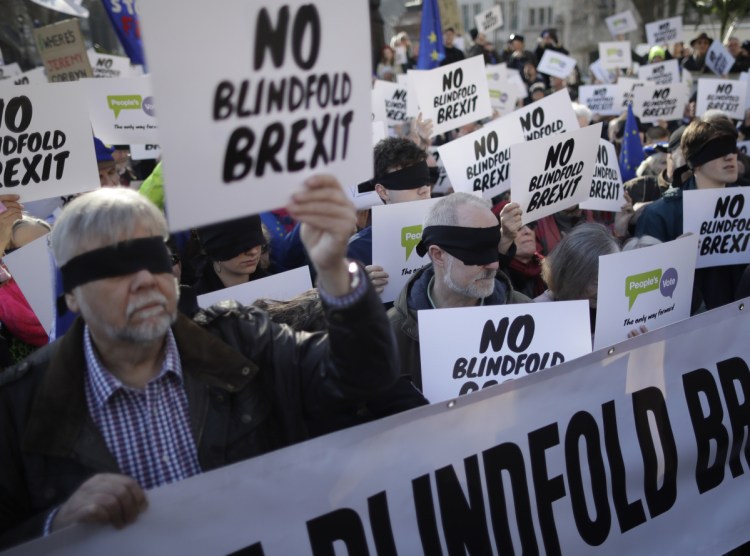 Remain in the European Union supporters wear blindfolds as they take part in a protest calling for a second referendum on Britain's EU membership.