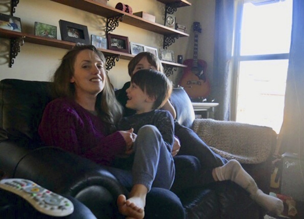 Aimee Maddonna sits with her children at her home in Simpsonville, S.C. The South Carolina mother has sued both the state and federal government, saying she's a victim of religious discrimination on the part of a federally funded foster-care agency that turned her down because of her Catholic faith.