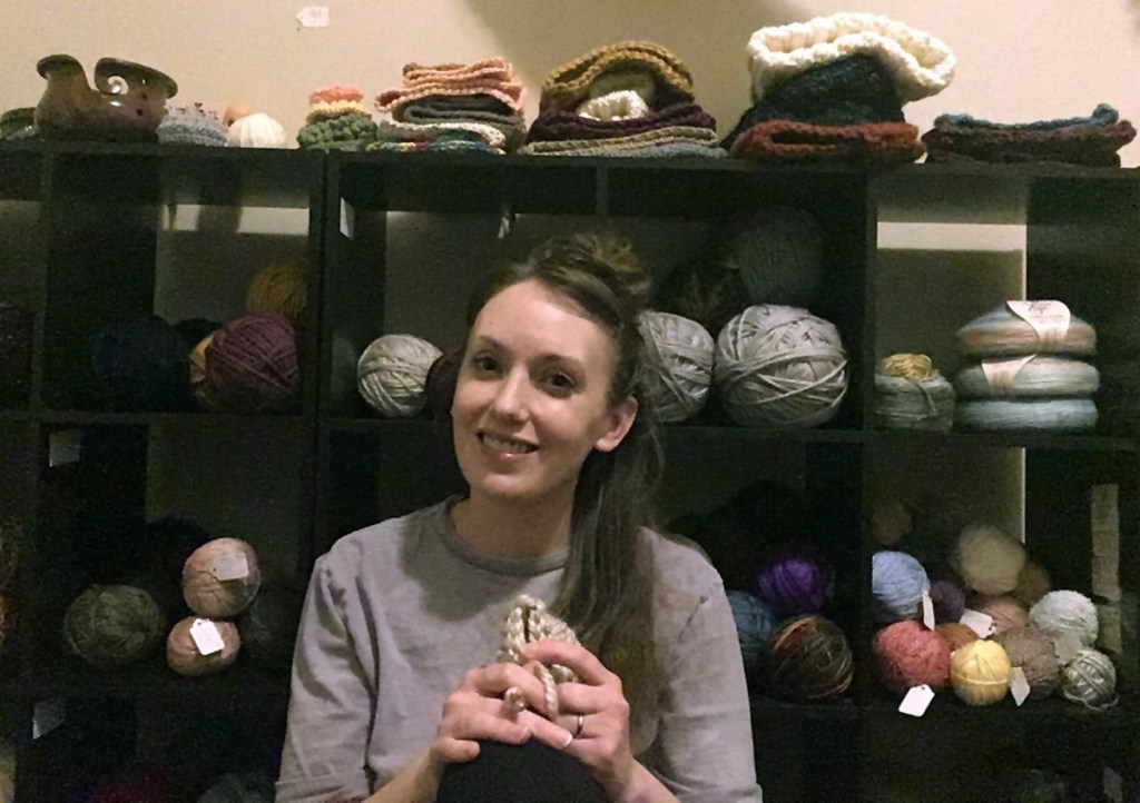 In this 2019 photo provided by Americans United for Separation of Church and State, Aimee Maddonna poses in a yarn store in Simpsonville, S.C. The South Carolina mother has sued both the state and federal government, saying she's a victim of religious discrimination on the part of a federally funded foster-care agency that turned her down because of her Catholic faith. Maddonna says the agency in 2014 initially encouraged her to become a foster parent but cut off ties once realizing that she is Catholic and not a "born-again" Christian, as the agency's internal rules require. (Courtesy of Aimee Maddonna/Americans United for Separation of Church and State via AP)