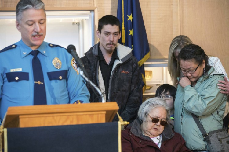 Col. Barry Wilson, director of the Alaska State Troopers, speaks Friday in Anchorage, announcing the arrest in Auburn, Maine, of Steven Downs in the 1993 murder of Sophie Sergie, 20. At right is her brother Stephen Sergie, her mother, Elena Sergie, and Olga Tinker-John, Elena's niece. Comforting Olga is Alaska Department of Public Safety Commissioner Amanda Price.