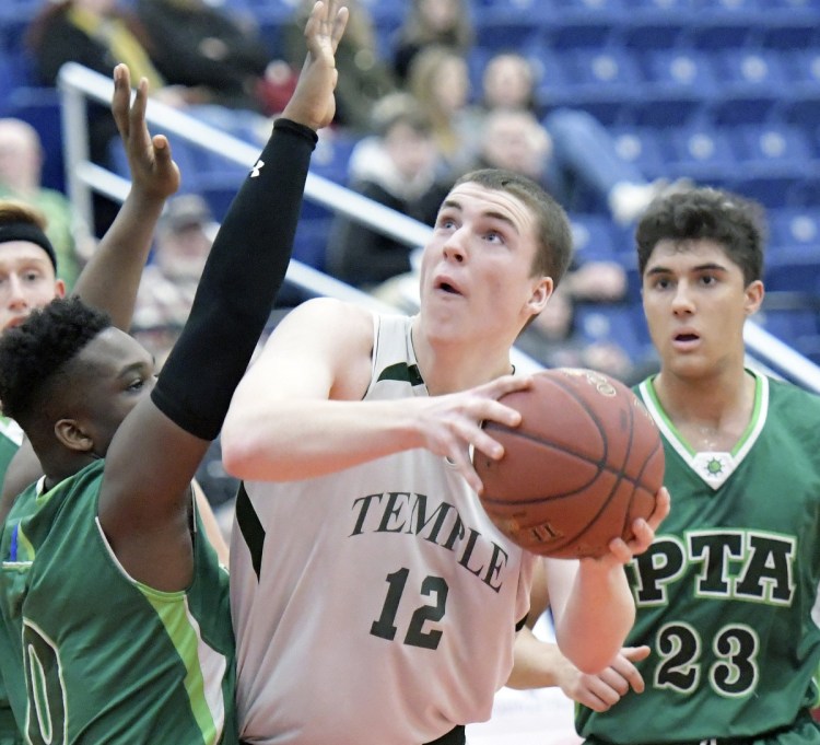 Temple Academy's Nick Blaisdell drives to the basket during a 63-44 win over Pine Tree Academy in a Class D South quarterfinal Monday at the Augusta Civic Center.