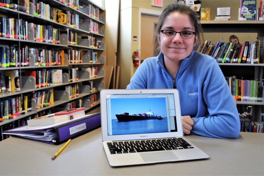 Sophia Meyer sits with her laptop at the Thornton Academy library on Friday.