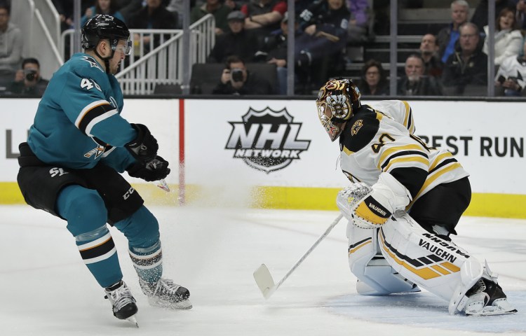 Bruins goalie Tuukka Rask defends against a shot from the Sharks' Tomas Hertl during the first period Monday night in San Jose, Calif.