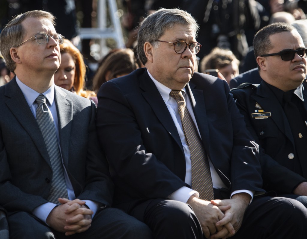 Attorney General William Barr listens to President Trump speak in the Rose Garden at the White House in Washington on Friday.