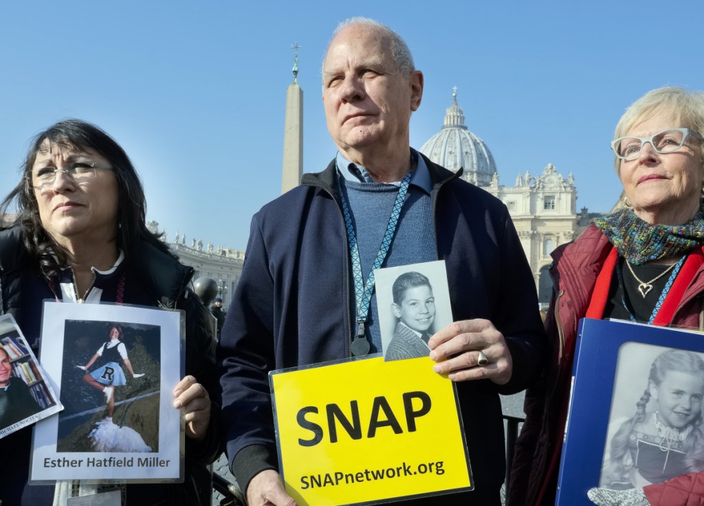 Survivors Network of those Abused by Priests president Tim Lennon stands in St. Peter's Square Wednesday on the eve of a Vatican summit.
