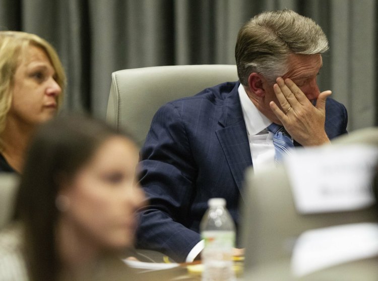 Mark Harris, Republican candidate in North Carolina's 9th Congressional race, fights back tears at the conclusion of his son John Harris's testimony during the third day of a public evidentiary hearing on the 9th Congressional District voting irregularities investigation on Wednesday.