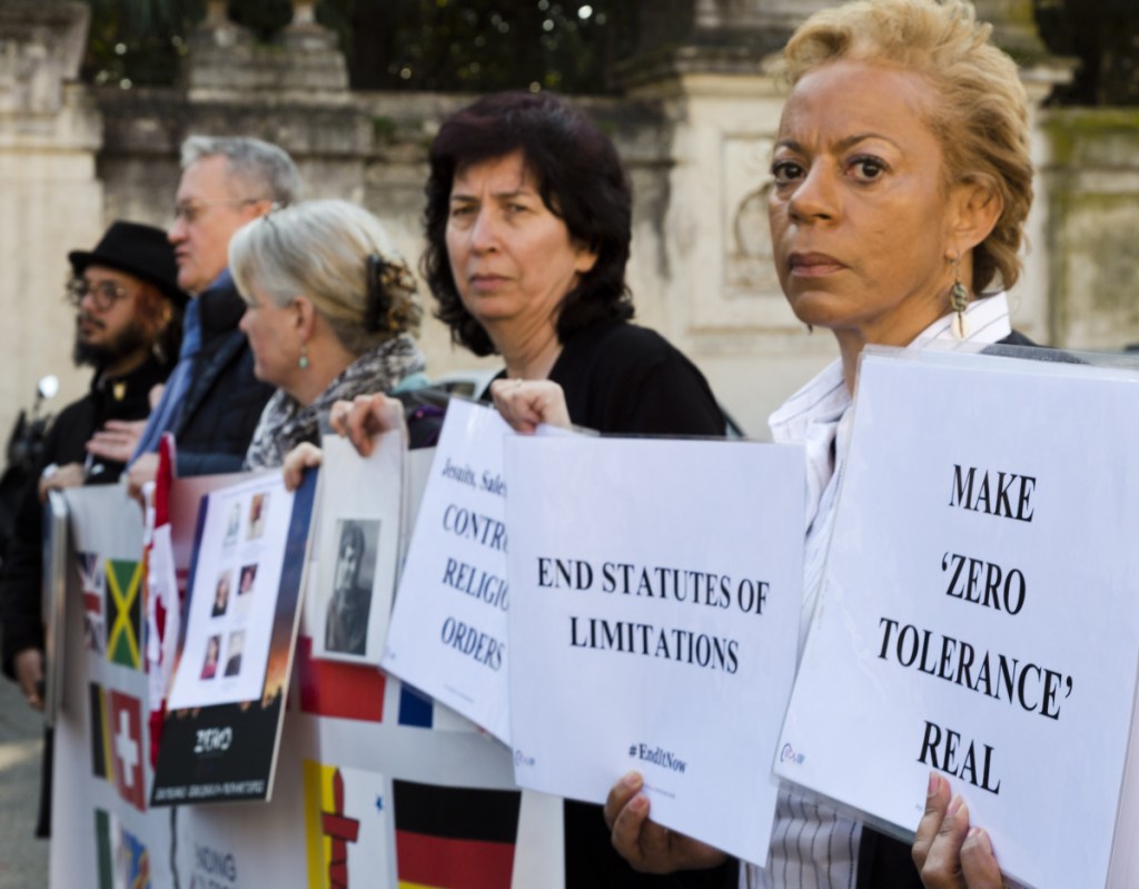 At left, psychoneurologist and founding member of the Ending Clergy Abuse (ECA) organization, Denise Buchanan, right, and member Leona Huggins, second from right, participate in a protest in Rome.
outside the St. Anselm on the Aventine Benedictine complex in Rome on the second day of a summit called by Pope Francis at the Vatican on sex abuse in the Catholic Church, Friday, Feb. 22, 2019. Pope Francis has issued 21 proposals to stem the clergy sex abuse around the world, calling for specific protocols to handle accusations against bishops and for lay experts to be involved in abuse investigations. (AP Photo/Domenico Stinellis)