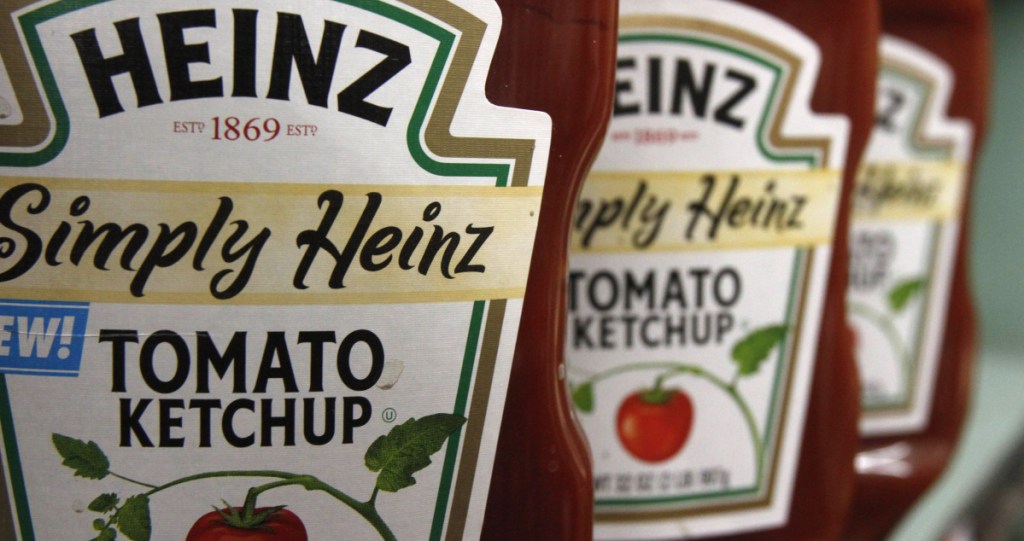 Shares in Kraft Heinz plunged Friday after it said it was being investigated by U.S. regulators and it reported a massive loss.