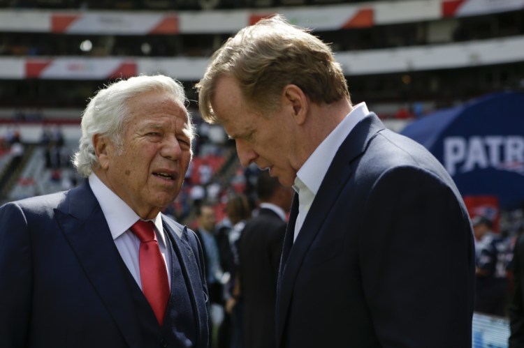 NFL Commissioner Roger Goodell, right, talks with New England Patriots owner Robert Kraft in 2017. Pending the completion of police investigations in Florida, and likely a league probe as well, Goodell could punish Kraft for being charged with two counts of soliciting a prostitute.