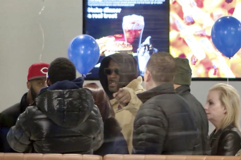 R. Kelly stopped at a McDonald's restaurant in Chicago on Monday after a suburban Chicago woman posted the $100,000 bail for him to be freed from jail while he awaits trial on sexual abuse charges. (WFLD via AP)
