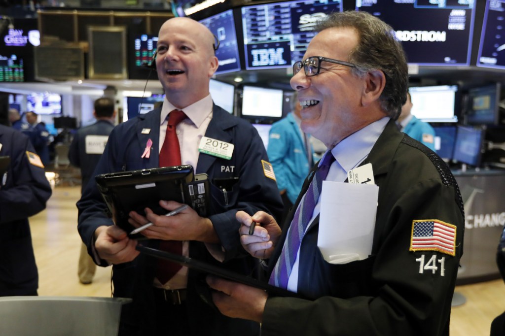 Patrick Casey, left, and Sal Suarino work on the floor of the New York Stock Exchange on Feb. 15.