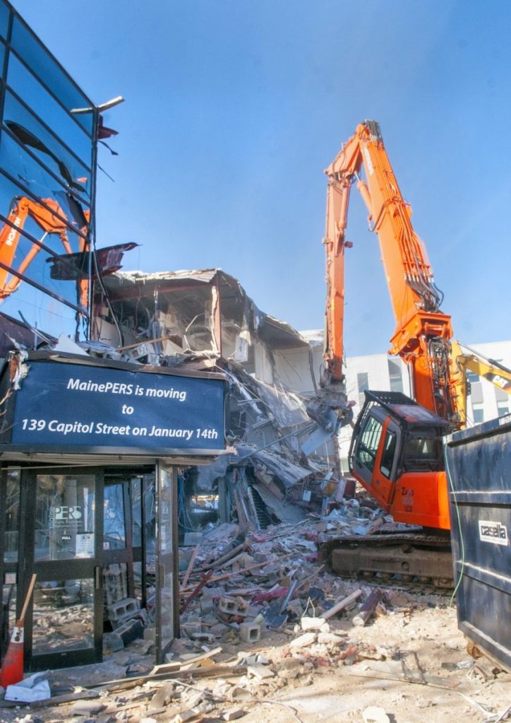 Kennebec Journal photo by Joe Phelan
Excavators tear apart the old Maine Public Employees Retirement System building on Wednesday at the corner of Sewall and Capitol streets near the Maine State House in Augusta.