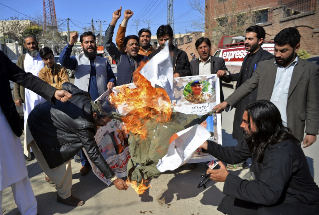 Pakistani protesters burn an effigy of Indian Prime Minister Narendra Modi during a rally in Peshawar, Pakistan, on Wednesday.