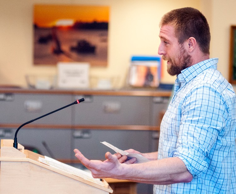 Joshua Kane of Bar Harbor, who said he's been on a wait list for a lobster license for nine years, testifies Tuesday in favor of the bill to give a license to anyone who has completed the state apprentice program and waited for 10 years or more.