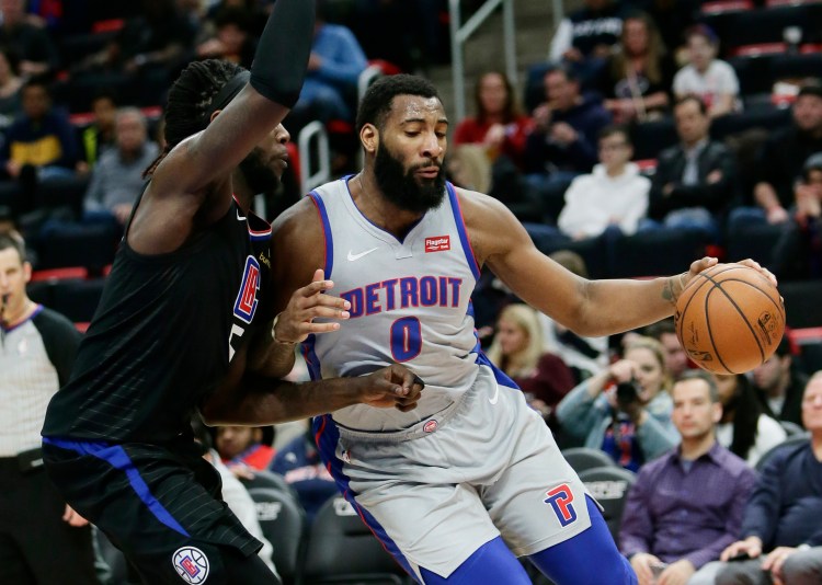 Detroit Pistons center Andre Drummond drives to the basket against Los Angeles Clippers forward Montrezl Harrell during the first half Saturday in Detroit. 