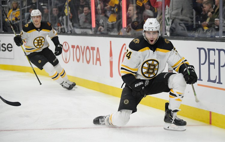 Boston Bruins left wing Jake DeBrusk, right, and left wing Peter Cehlarik celebrate DeBrusk's goal during the first period of the Bruins' 4-2 win over the Los Angeles Kings on Saturday in Los Angeles.