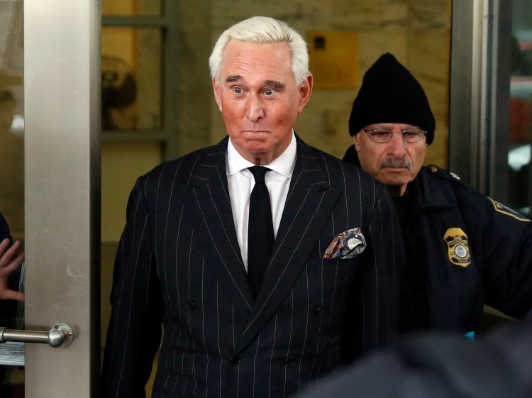 FILE - In this Feb. 1, 2019, file photo, former campaign adviser for President Donald Trump, Roger Stone, leaves federal court in Washington. President Donald Trump's longtime confidant Stone has apologized to the judge presiding over his criminal case for an Instagram post featuring a photo of her with what appears to be the crosshairs of a gun. Stone and his lawyers filed a notice Monday night, Feb. 18, saying Stone recognized "the photograph and comment today was improper and should not have been posted." (AP Photo/Pablo Martinez Monsivais, File)