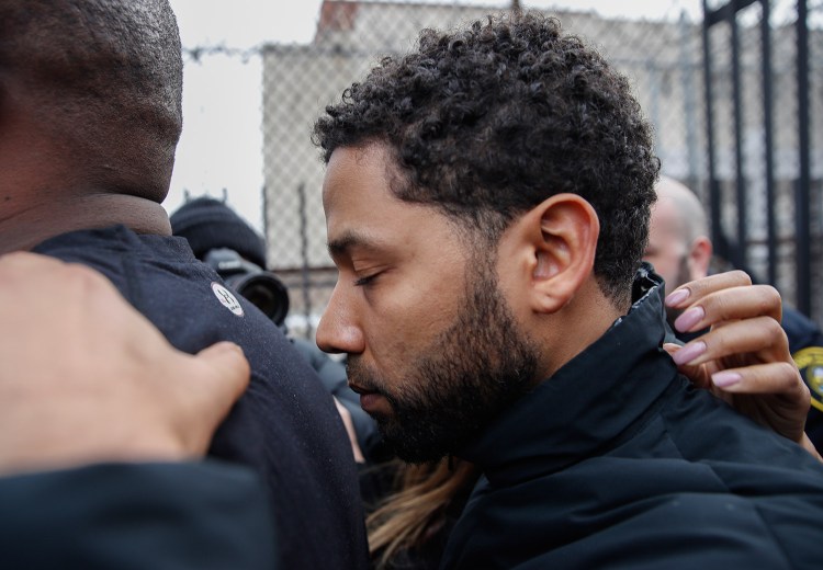 "Empire" actor Jussie Smollett leaves the Cook County jail after his release Thursday in Chicago. Smollett was charged with disorderly conduct and filling a false police report for saying he was attacked in downtown Chicago by two men who hurled racist and anti-gay slurs and looped a rope around his neck.