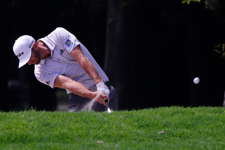 Dustin Johnson hits the ball on the third hole in the third round of the Mexico Championship on Saturday at the Chapultepec Golf Club in Mexico City.