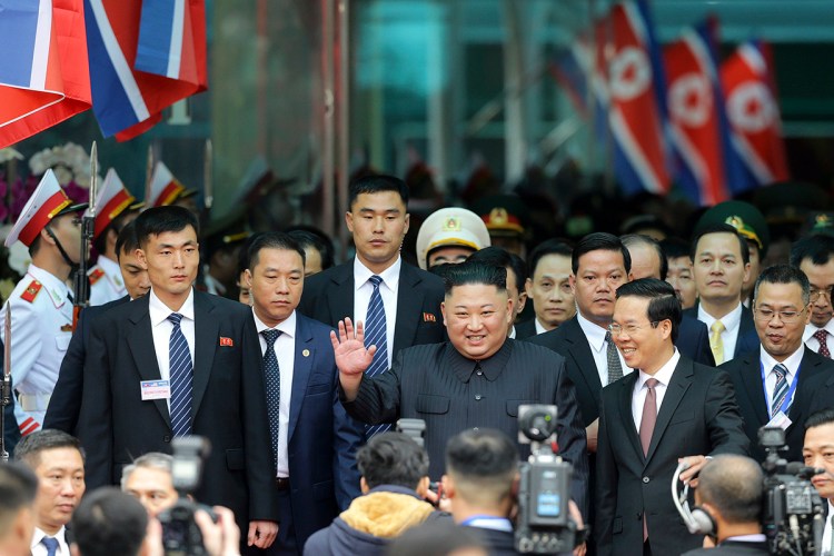 North Korean leader Kim Jong Un waves upon his arrival by train Tuesday in Dong Dang, a Vietnamese border town, before his second summit with President Trump. 