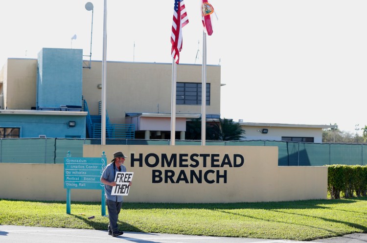 In this Feb. 19, 2019, photo, Josh Rubin demonstrates in front of the Homestead Temporary Shelter for Unaccompanied Children in Homestead, Fla. House Democrats are laying the groundwork to subpoena Trump administration officials over family separations at the southern border. 