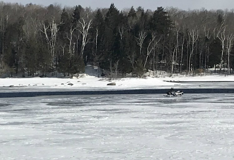A snowmobile owned by Nicholas Smith of Berwick who escaped without injury during last night’s rescue on Sebec Lake. The incident took place about  a half-mile West of Sebec Lake Dam.

