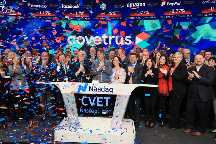 Benjamin Shaw, president and CEO of Covetrus Inc., celebrates the listing of its stock Friday by ringing the opening bell of the Nasdaq stock exchange in New York's Times Square.