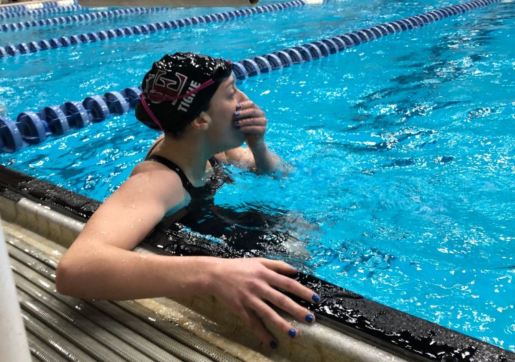 Cape senior Olivia Tighe realizes she just broke the state record for the 200 yard freestyle with a time of 1:50.21 during the Class B state swimming and diving championships. 