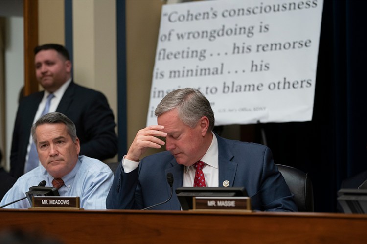 Rep. Mark Meadows, R-N.C., joined at left by Rep. Jody Hice, R-Ga., leads objections to testimony by Michael Cohen, President Donald Trump's former personal lawyer, at the House Oversight and Reform Committee on Wednesday.