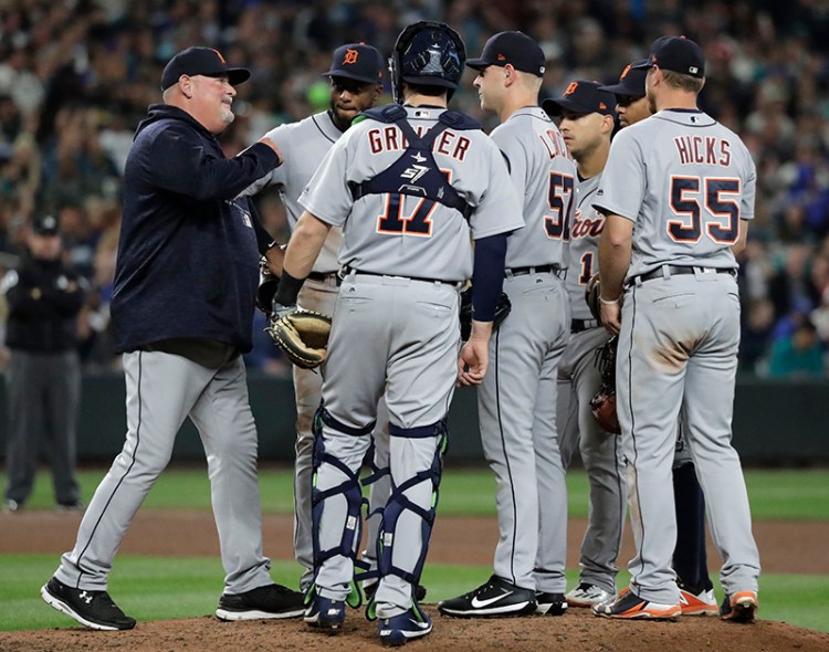Detroit Tigers pitching coach meet at the mound in May 2018. Under proposed rules, the number of trips to the mound would be reduced from six to five.