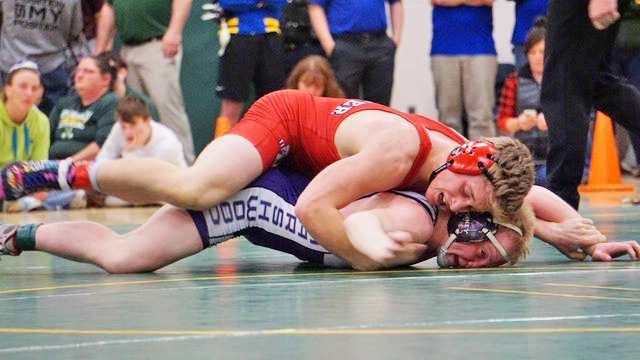 Dexter’s Gage Stone brings down Marshwood’s David Spinney during the 152-pound championship at the New England qualifier tournament Saturday at Oxford Hills Comprehensive High School.