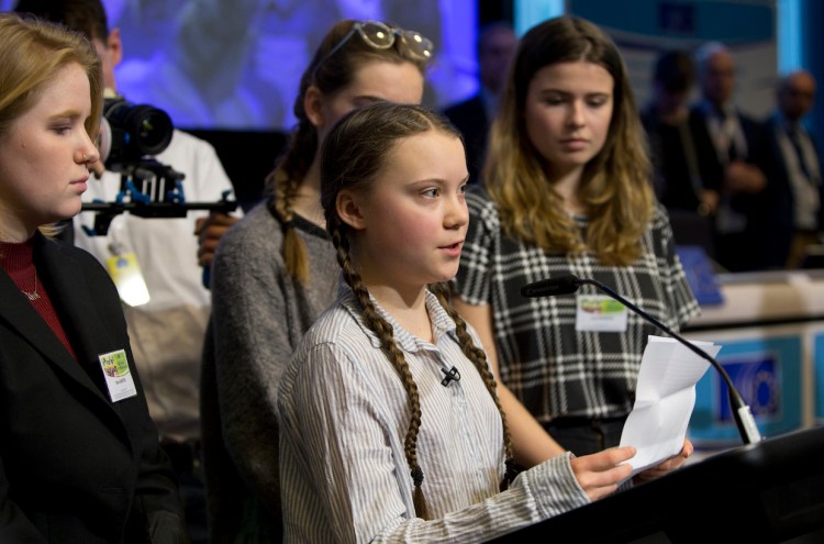 Swedish climate activist Greta Thunberg, center, speaks during an event at the EU Charlemagne building in Brussels on Thursday.