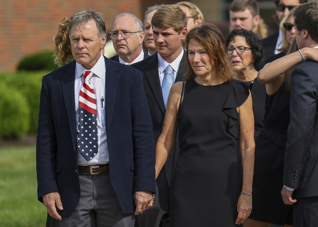Fred and Cindy Warmbier watch as their son Otto's casket is placed in a hearse after his funeral Wyoming, Ohio, on June 22, 2017. The Warmbiers spoke out Friday after President Trump's comment this week that he takes North Korean leader Kim Jong Un "at his word" that he was unaware of any mistreatment during their son's 17 months of captivity. Warmbier died at age 22 soon after his return home in June 2017.