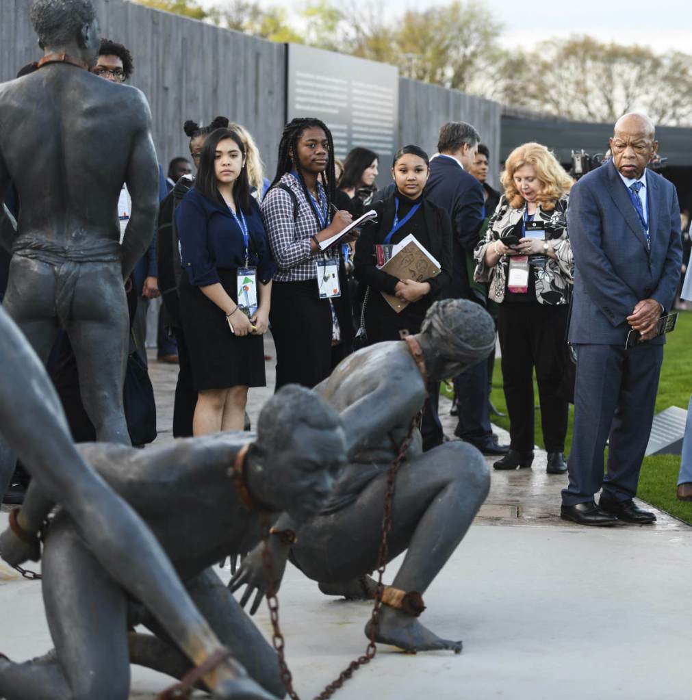 U.S. Rep. John Lewis, D-Ga., far right, tours the National Memorial for Peace and Justice in Montgomery, Ala., during a stop Friday on the Congressional Civil Rights Pilgrimage.