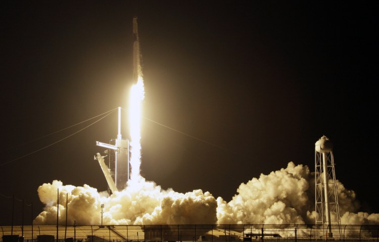 A SpaceX Falcon 9 rocket with a demo Crew Dragon spacecraft lifts off  on an uncrewed test flight to the International Space Station at the Kennedy Space Center in Cape Canaveral, Fla., on Saturday.