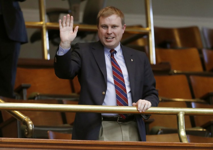 Rep. Aaron Frey, D-Bangor, acknowledges applause at the State House in Augusta early in December when he was elected by the Legislature to become Maine's next attorney general. In Maine, lawmakers choose the state's constitutional officers.