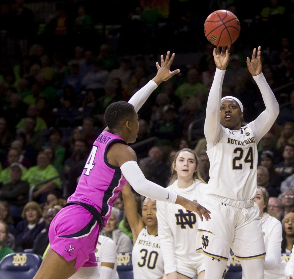 Notre Dame's Arike Ogunbowale shoots a 3-pointer during her team's 103-66 win Sunday over Virginia.