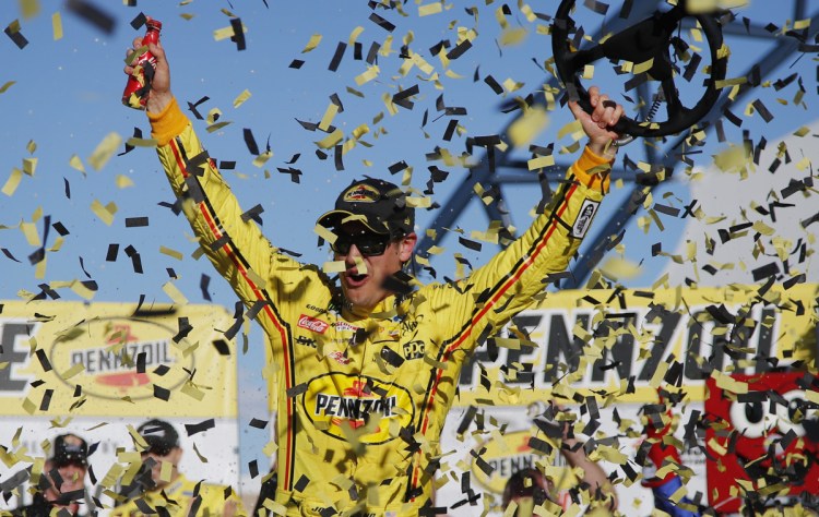 Joey Logano celebrates after holding off Brad Keselowski to win the NASCAR Cup Series race Sunday in Las Vegas.
