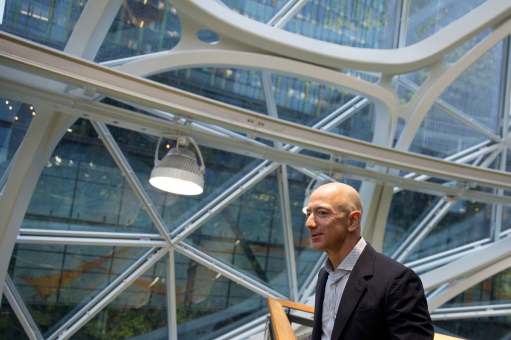 Bloomberg/Mike Kane
Jeff Bezos, founder and chief executive officer of Amazon, tours the Spheres during opening day ceremonies at the company's campus in Seattle on Jan. 29, 2018. Amazon has several family-friendly policies such as allowing employees to work part-time for eight weeks following childbirth and reimbursing mothers traveling for work for their breast milk shipping expenses. But many Amazon moms say a missing link is backup day care. Apple, Microsoft, Facebook and Google parent Alphabet Inc. all provide backup day care benefits.