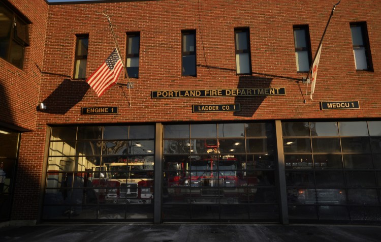 The flag is at half-staff Tuesday at the Portland fire station on Munjoy Hill in memory of Berwick Fire Capt. Joel Barnes, who died Friday in a fire in Berwick.