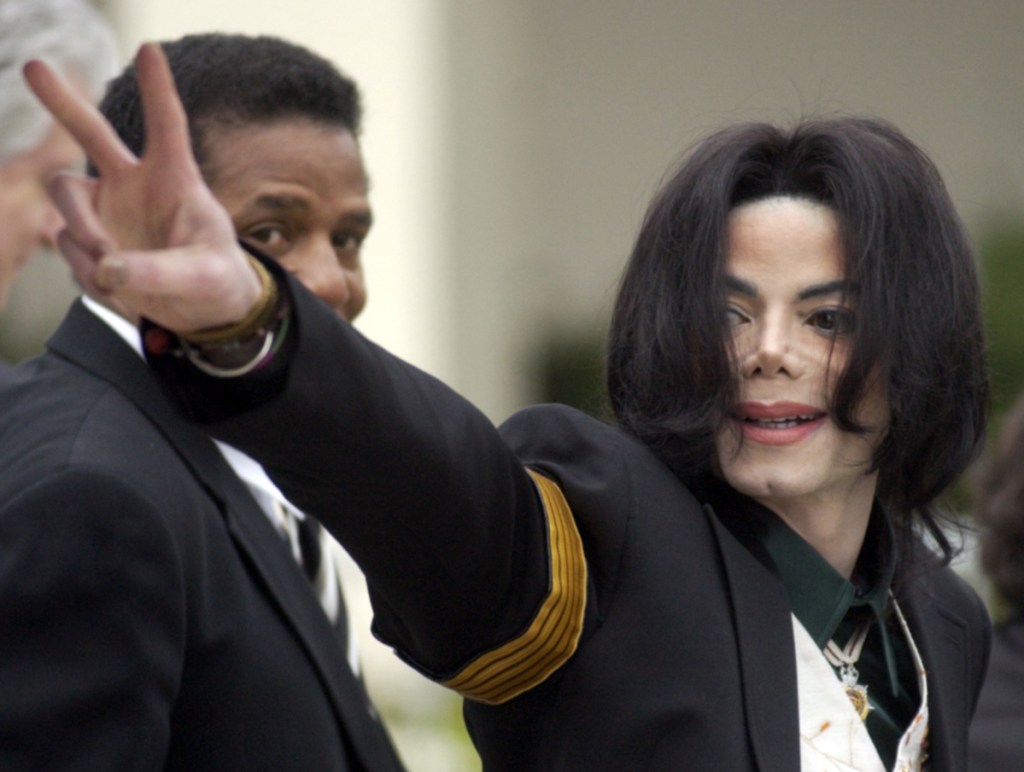 Michael Jackson waves to his supporters as he arrives for his child molestation trial in Santa Maria, Calif., in 2005. "Leaving Neverland," an HBO documentary, focuses on the abuse allegations of two men, Wade Robson and James Safechuck.
