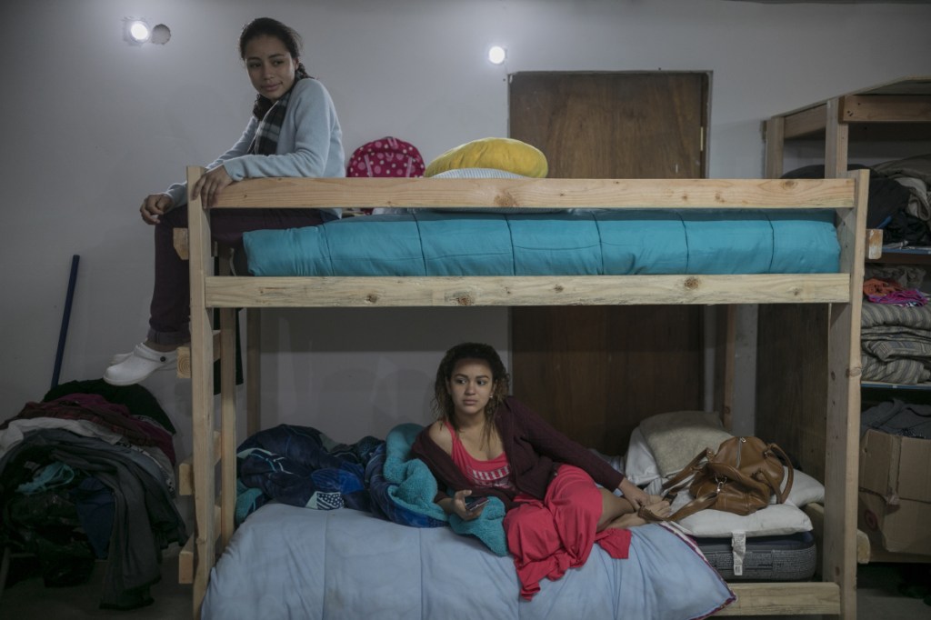 Migrants Xiomara Henriquez Ayala, 13, and Valeria Ramos of Honduras, 18, share bunkbeds at the Agape World Mission shelter in Tijuana, Mexico.
Associated Press/Emilio Espejel